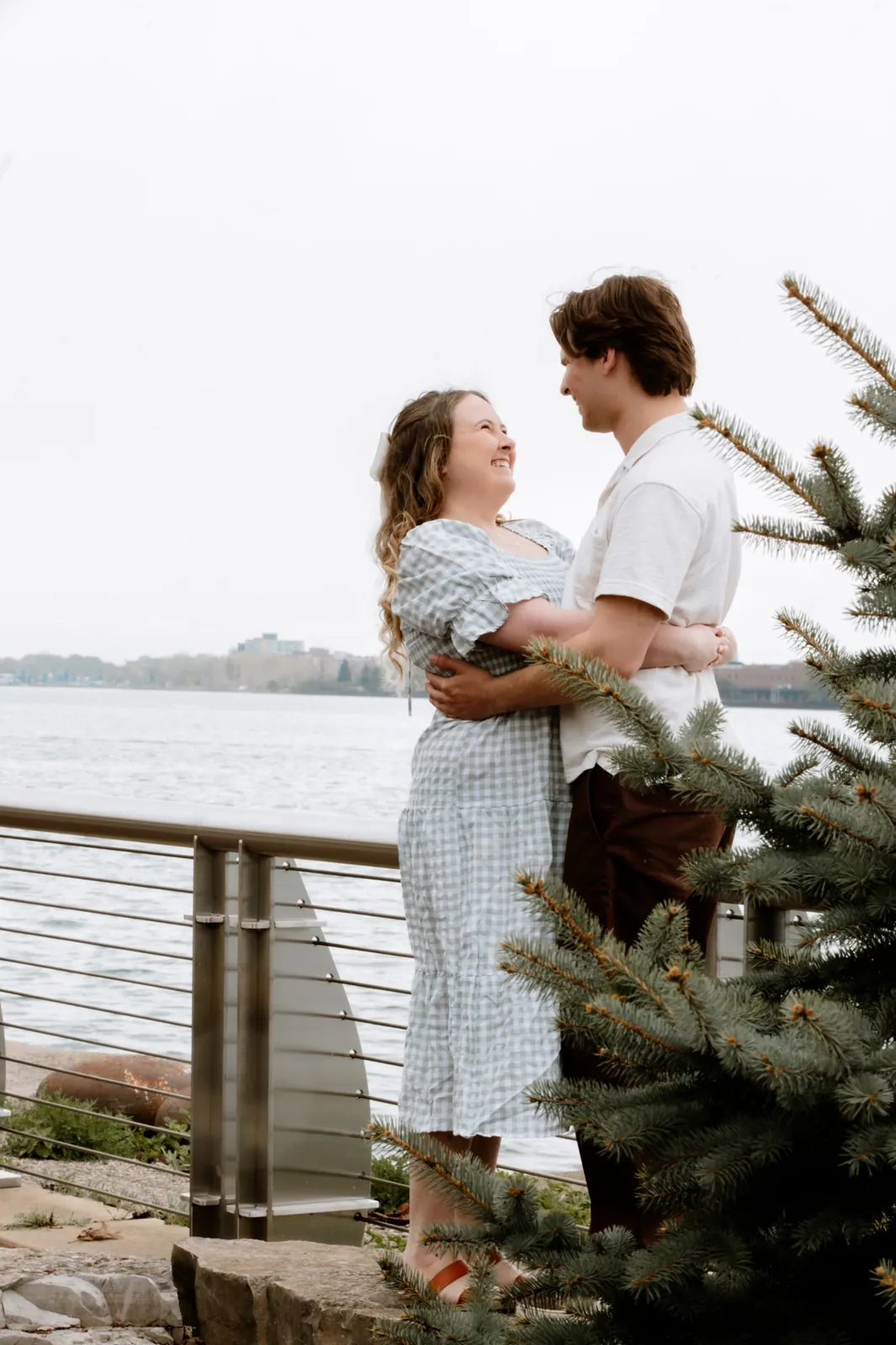 Gavin and Ally holding each other and smiling by the river
