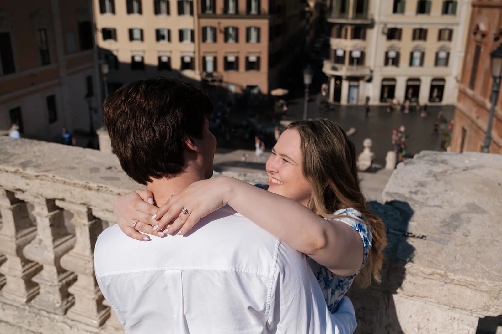 Ally, wearing the engagement ring, with arms around Gavin at the top of the Spanish Steps in Rome